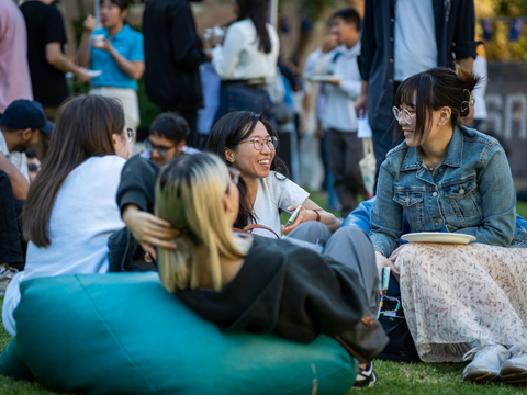 Students sitting on the grass
